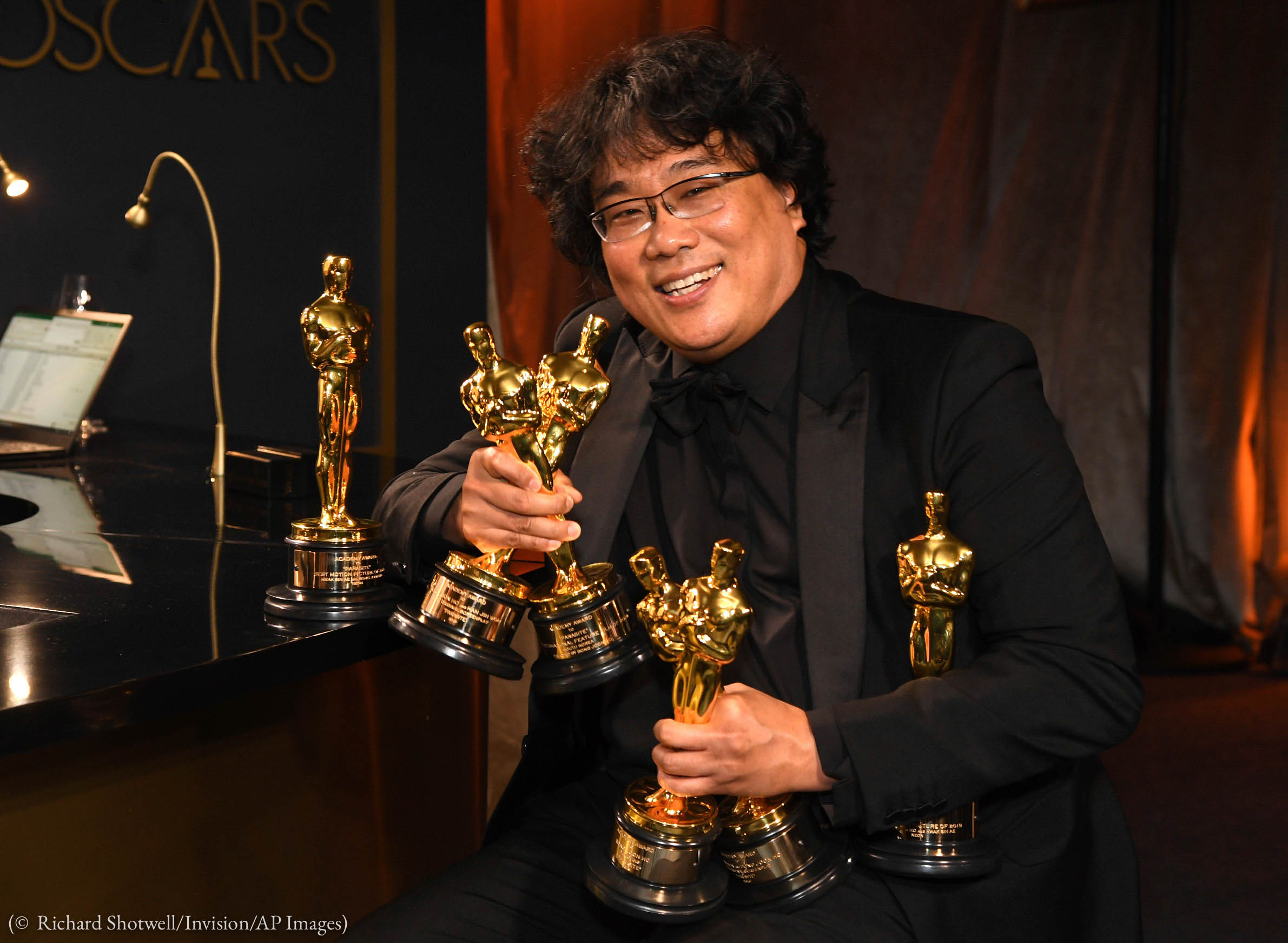 Bong Joon-ho holds the Oscars for best original screenplay, best international feature film, best directing, and best picture for "Parasite" at the Governors Ball after the Oscars on Sunday, Feb. 9, 2020, at the Dolby Theatre in Los Angeles. (Photo by Richard Shotwell/Invision/AP)